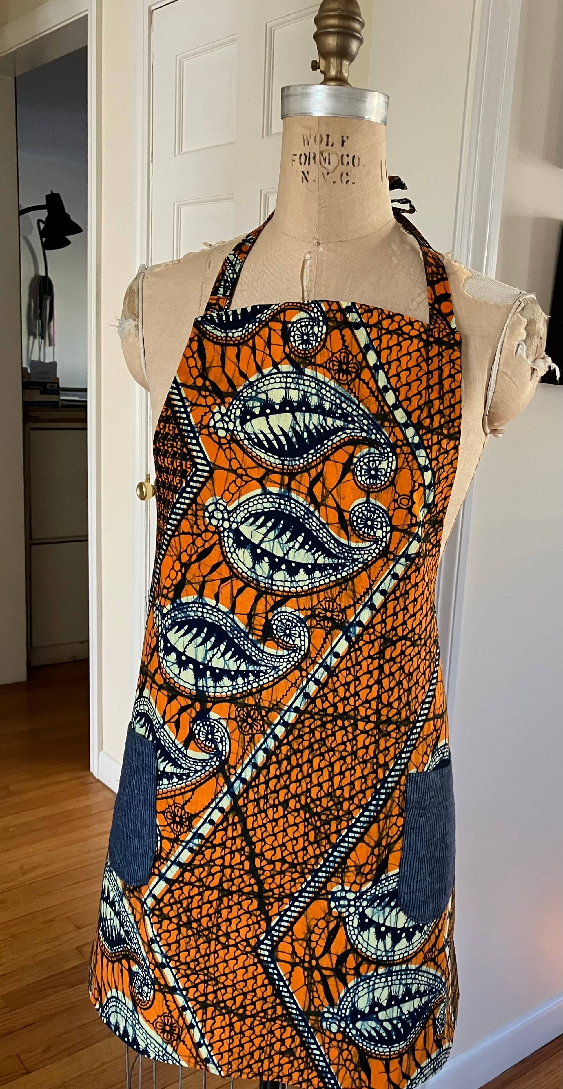 Orange/blue African print bib apron .