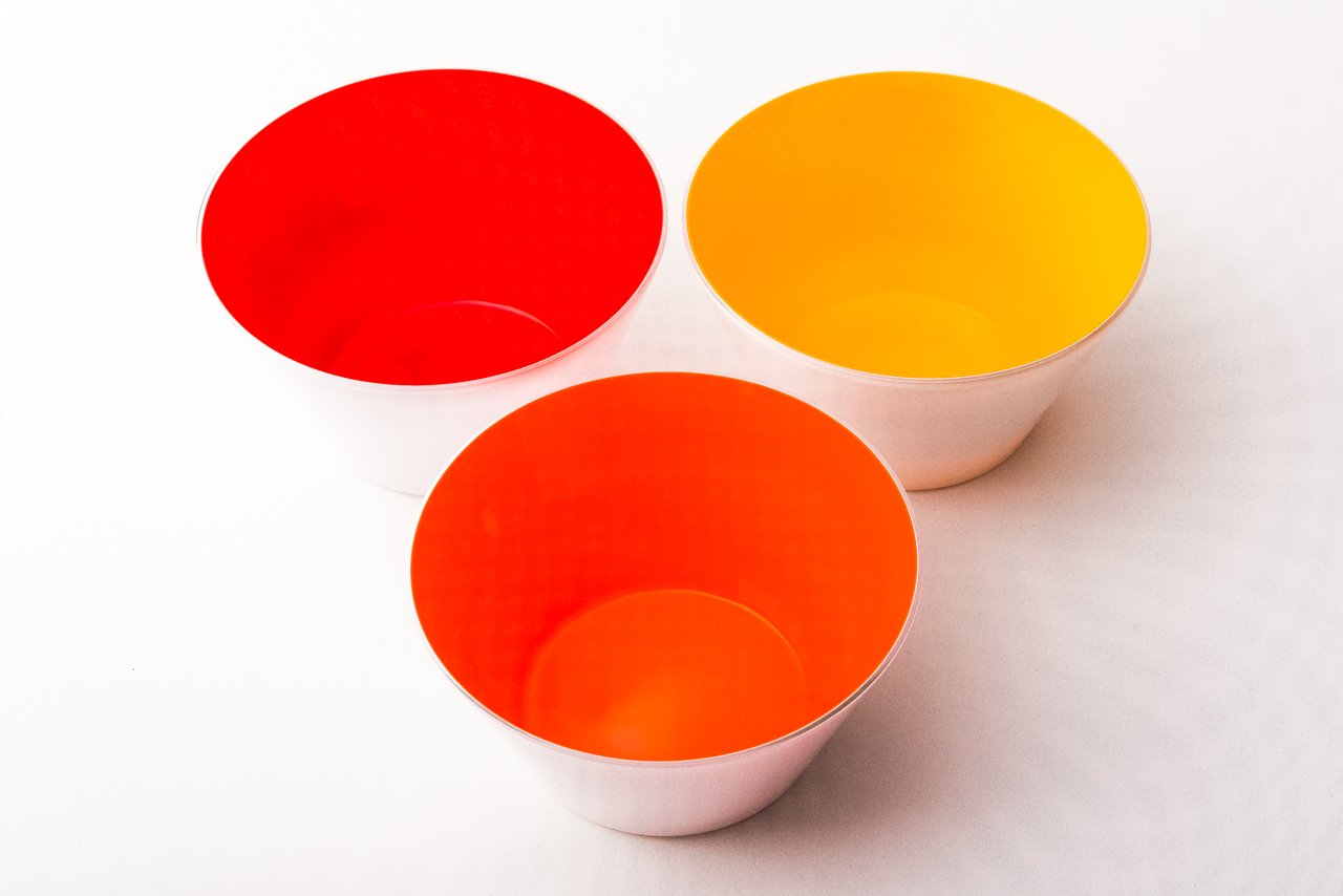 Three small handblown glass bowls in bright orange, (Sunrise), Gold and Red. Made in the USA from Serve Kindness 